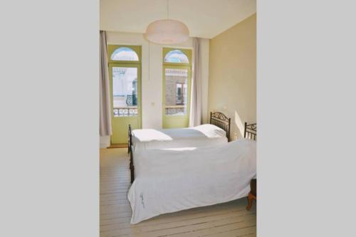 Ліжко або ліжка в номері Villa Les Eglantines in Belle Epoque wijk Oostende