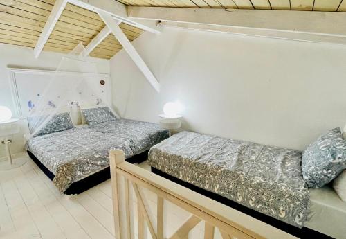 a bedroom with two beds in a room at bungalow 3116 vue sur piscine in Las Galeras