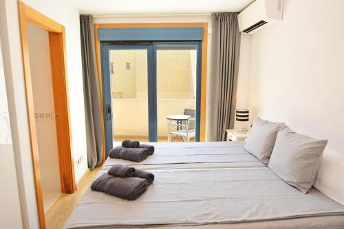 Ένα ή περισσότερα κρεβάτια σε δωμάτιο στο Ático Antares