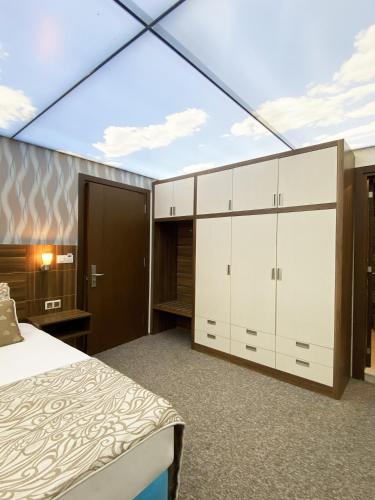 a bedroom with a bed and a glass ceiling at Emily Rose Hotel in Kemer