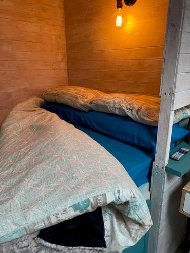 a room with two bunk beds in a house at The Old Garage in Saltdean
