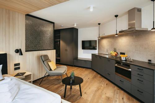 a kitchen and living room with a bed and a table at mein-schlafplatz - Leben - Arbeiten - Wohnen in Heidenheim