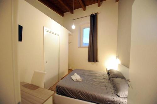 Katil atau katil-katil dalam bilik di Affittacamere Fravina