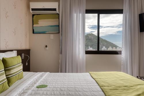 Tempat tidur dalam kamar di Quality Suites Vila Velha