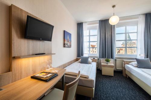 Postel nebo postele na pokoji v ubytování Hotel Jensen