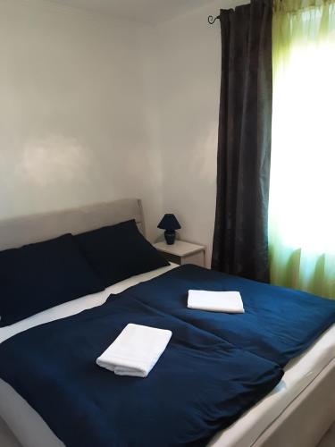 Cama o camas de una habitación en MELÁNIA