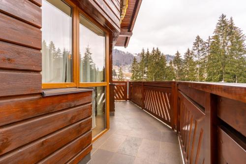 a balcony of a cabin with a view of the mountains at Villa Gardenia in Donovaly