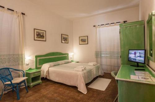 Ένα ή περισσότερα κρεβάτια σε δωμάτιο στο Hotel Sandalyon