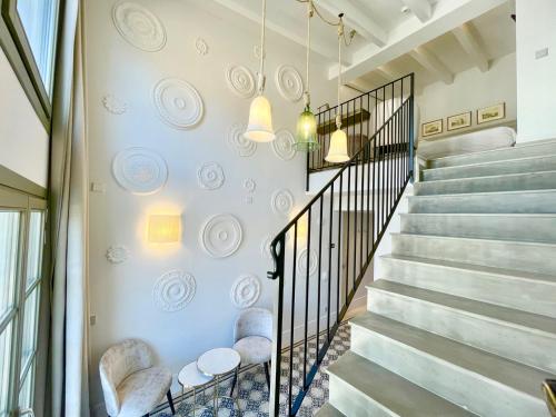a staircase in a house with a stair railing at Hotel Basilica in Palma de Mallorca