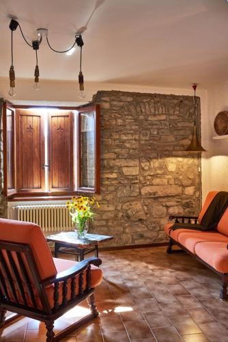 a living room with a couch and a table at Casa Sibiel in Pognana Lario