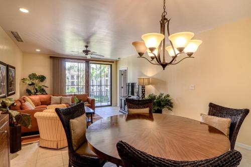 a living room with a table and a couch at Pacifico Lifestyle L1009 in Coco