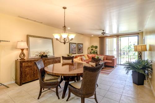 a living room with a table and chairs and a couch at Pacifico Lifestyle L1009 in Coco