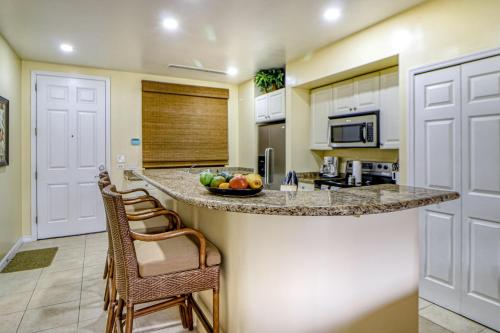 a kitchen with a counter with a bowl of fruit on it at Pacifico Lifestyle L1009 in Coco