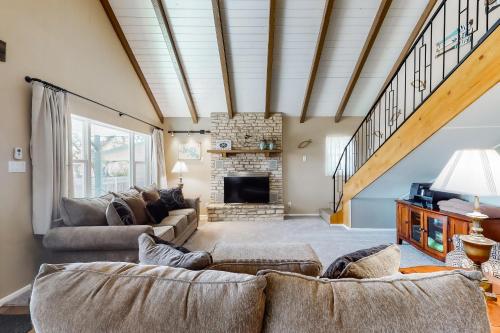 a living room with a couch and a fireplace at Deer Ridge in Canyon Lake