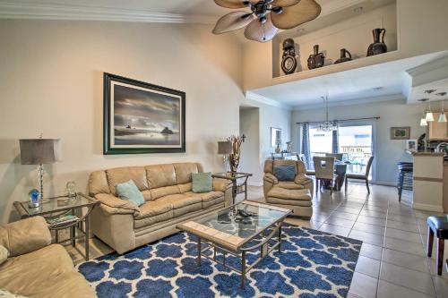a living room with a couch and a table at South Padre Island Condo with Pool Access and Balcony! in South Padre Island