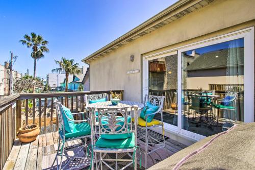 a patio with chairs and tables on a balcony at South Padre Island Condo with Pool Access and Balcony! in South Padre Island