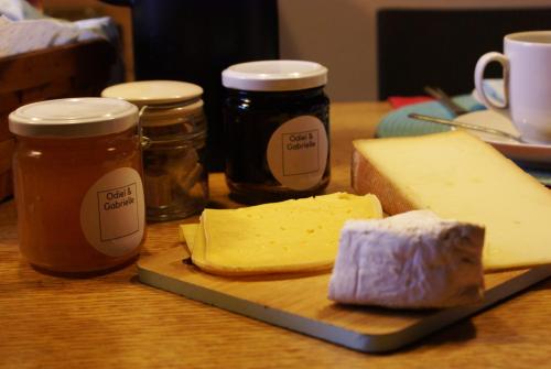 a table topped with jars of butter and cheese at Odiel & Gabrielle in Montchevrier