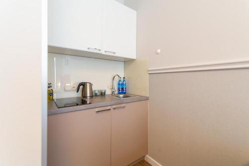 Kuchyň nebo kuchyňský kout v ubytování Baltic Apartamenty