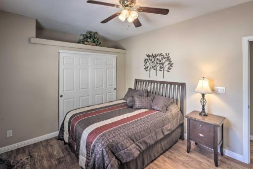 a bedroom with a bed and a ceiling fan at Rivers Edge Golf Condo with Beach Access and Patio! in Needles