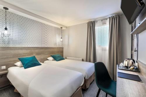 Säng eller sängar i ett rum på Sure Hotel by Best Western Calais Coquelles Tunnel s/ Manche