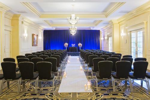 a large room with rows of chairs and a chandelier at Crowne Plaza Hotel Portland-Downtown Convention Center by IHG in Portland