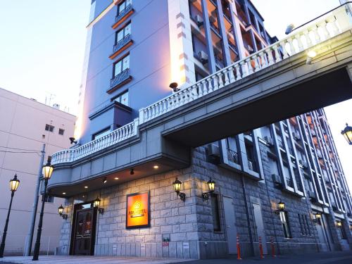 a building with a balcony on the side of it at APA Hotel Honhachinohe in Hachinohe