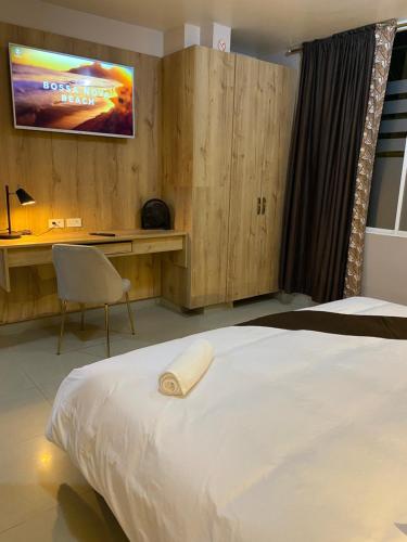Tempat tidur dalam kamar di Hotel Wampushkar