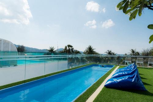 The swimming pool at or close to BearPacker Patong Hostel