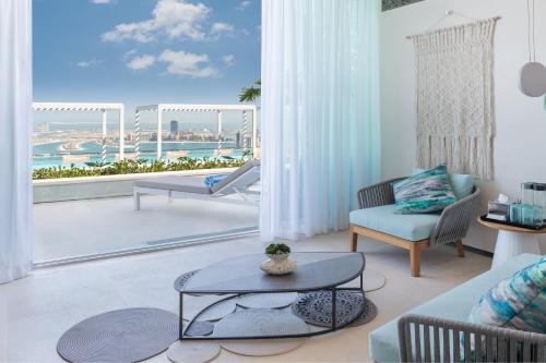 a living room with a view of the ocean at Address Beach Resort in Dubai