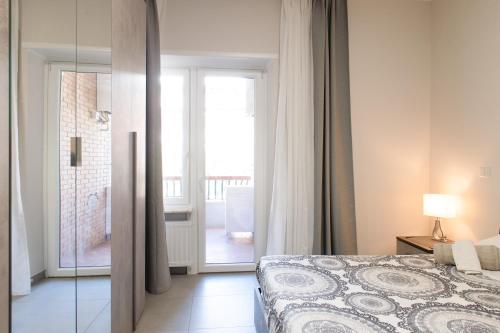 Postel nebo postele na pokoji v ubytování Appartamento Simonetti