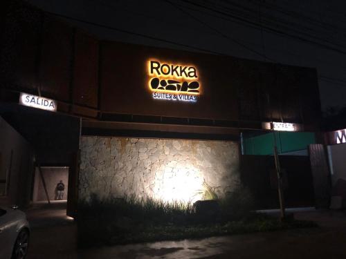a building with a roka casino sign on it at night at Motel Rokka in Guadalajara