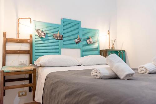 Posteľ alebo postele v izbe v ubytovaní Appartamento Monsone