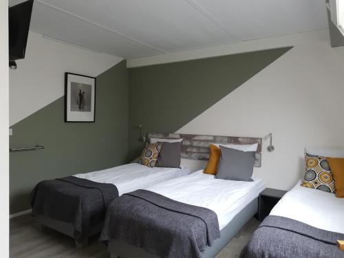 Postel nebo postele na pokoji v ubytování B&B Bovenweg
