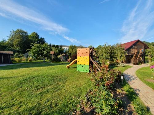 a playground in the middle of a yard at Lielās spāres in Pāvilosta