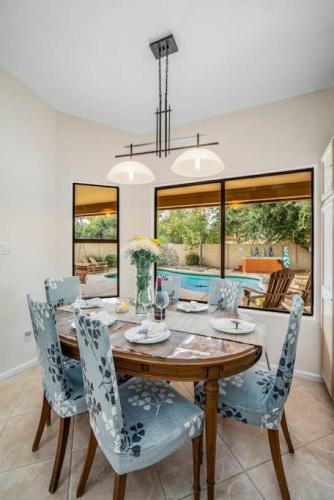 a dining room with a wooden table and chairs at Beautiful Scottsdale Escape Heated Pool, Spa, & Putting Green in Phoenix