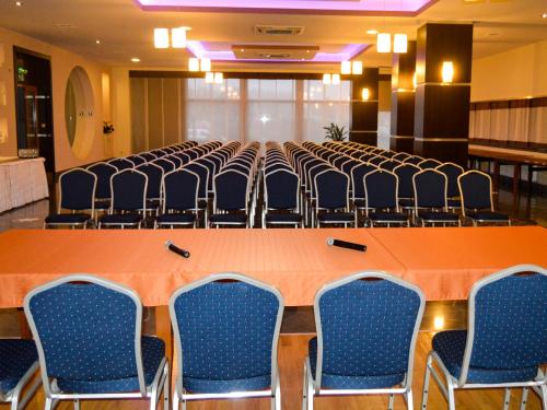 a large conference room with a long table and chairs at Hotel Aquarius Restaurant Wellness Spa in Ciechocinek