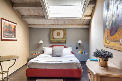 a bedroom with a bed and a skylight at Il Giardino di Ballarò Boutique B&B in Palermo