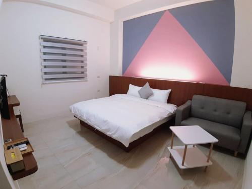 Кровать или кровати в номере 福門民宿