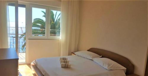 Postel nebo postele na pokoji v ubytování Adriatic Beach Suites