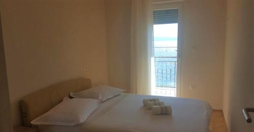 Postel nebo postele na pokoji v ubytování Adriatic Beach Suites