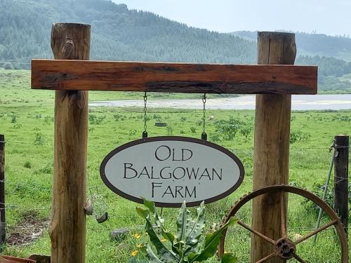an old barnarian farm sign hanging on a pole at Old Balgowan Farm Cottage in Balgowan