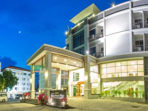 a large white building with a sign in front of it at Pangviman Place Resotel SHA Plus in Chiang Mai