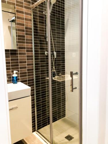 a bathroom with a shower and a sink at APARTAMENTO VACACIONAL - RELAX in Tossa de Mar