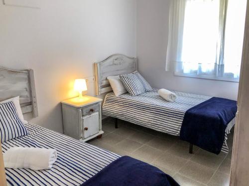 Posteľ alebo postele v izbe v ubytovaní APARTAMENTO VACACIONAL - RELAX