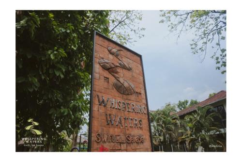 a sign that says we american wake single soup at Whispering Waters in Malayāttūr