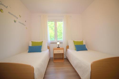 Ένα ή περισσότερα κρεβάτια σε δωμάτιο στο Bungalow Porec (4400-2)