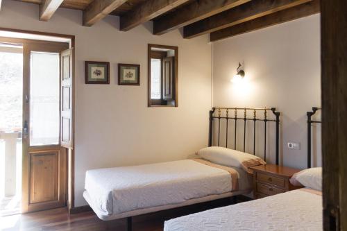 Postel nebo postele na pokoji v ubytování La Hospedería de Salamón