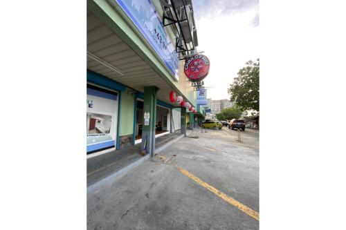 an empty street in front of a store at E Relaxed Haven Transient House in Manila