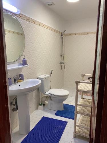 a bathroom with a toilet and a sink and a mirror at Appartement coeur de médina in Taroudant
