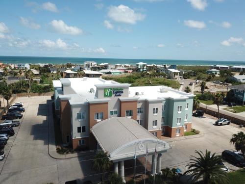 a view of a building with the ocean in the background at Holiday Inn Express Hotel and Suites Port Aransas/Beach Area by IHG in Port Aransas